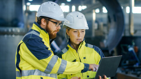 Forensic engineers working on a job site